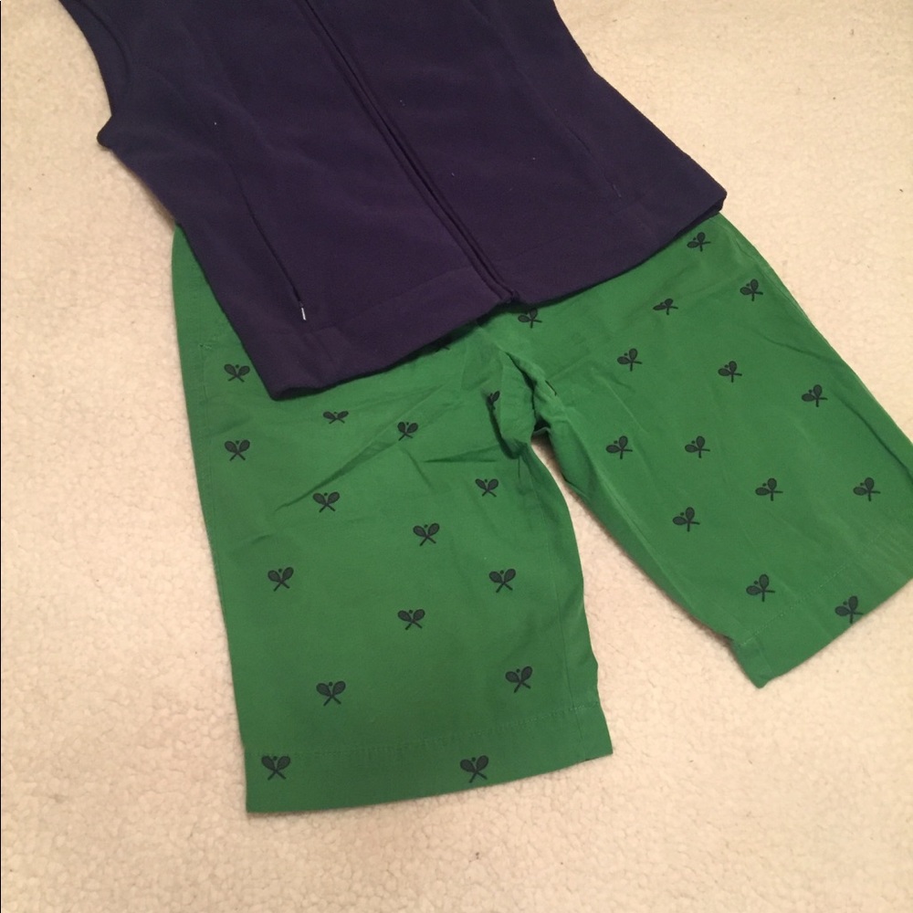 Green shorts with navy blue tennis racquets